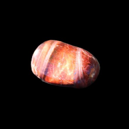Red Tigers Eye tumbled stone 26/28mm 11/13g in sunlight - Rocks and Things Store