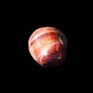 Red Tigers Eye tumbled stone 26/28mm 11/13g in sunlight - Rocks and Things Store