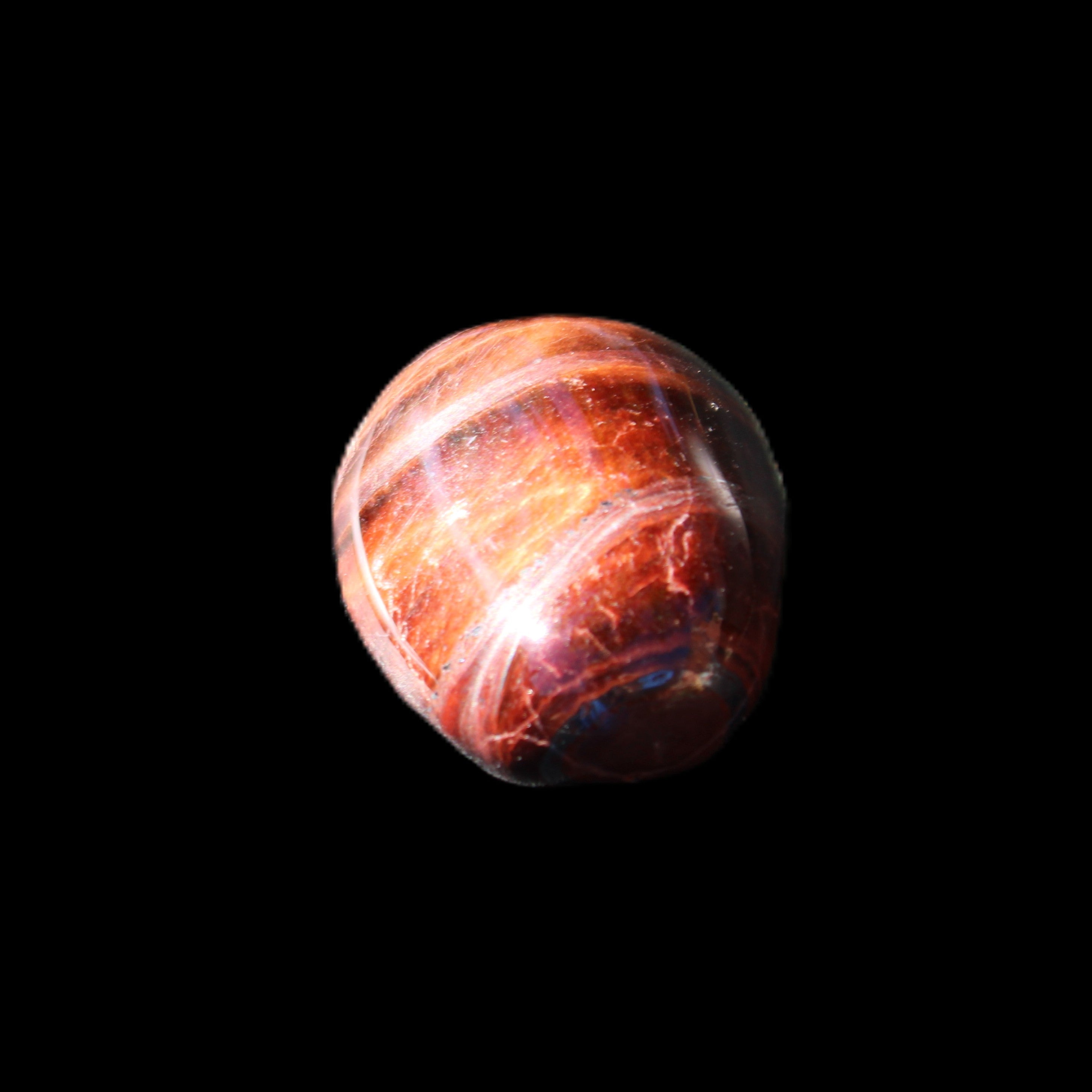 Red Tigers Eye tumbled stone 26/28mm 11/13g in sunlight - Rocks and Things Store