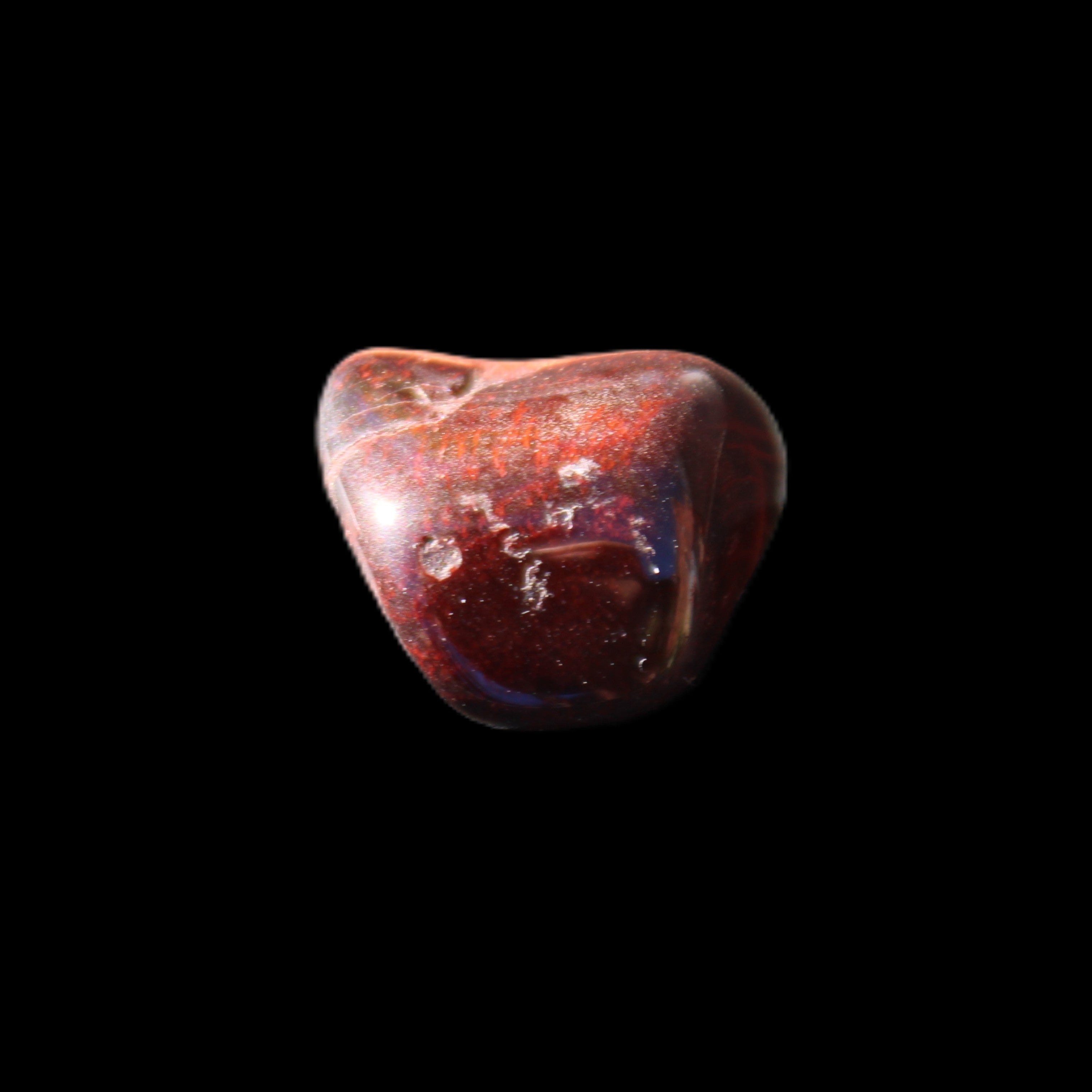 Red Tigers Eye tumbled stone 26/28mm 11/13g in sunlight - Rocks and Things Store