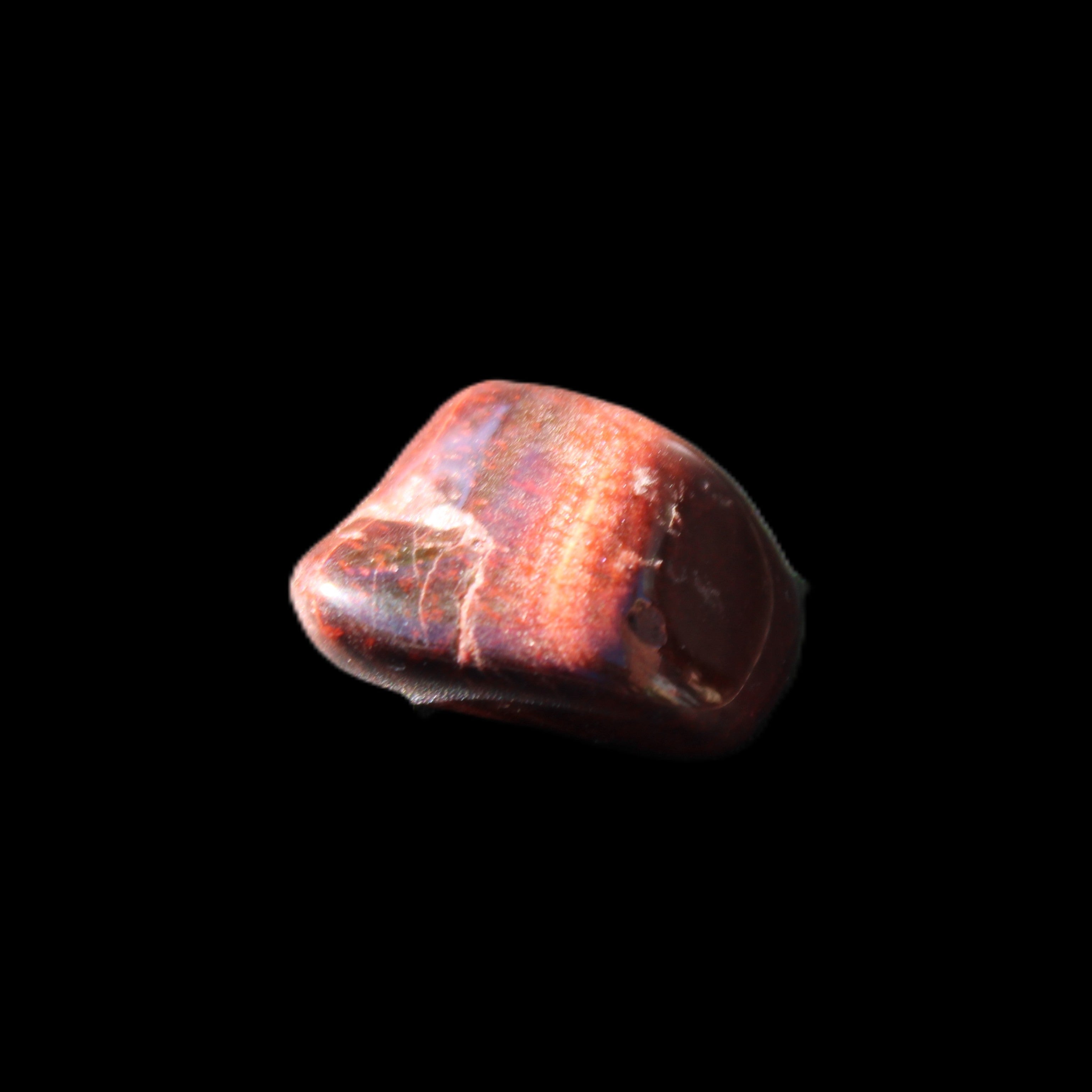 Red Tigers Eye tumbled stone 26/28mm 11/13g in sunlight - Rocks and Things Store