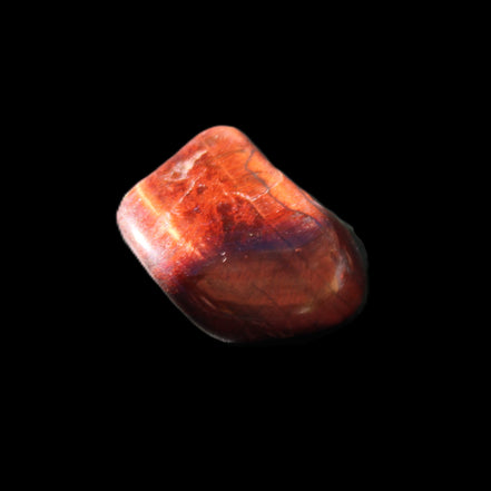 Red Tigers Eye tumbled stone 26/28mm 11/13g in sunlight - Rocks and Things Store