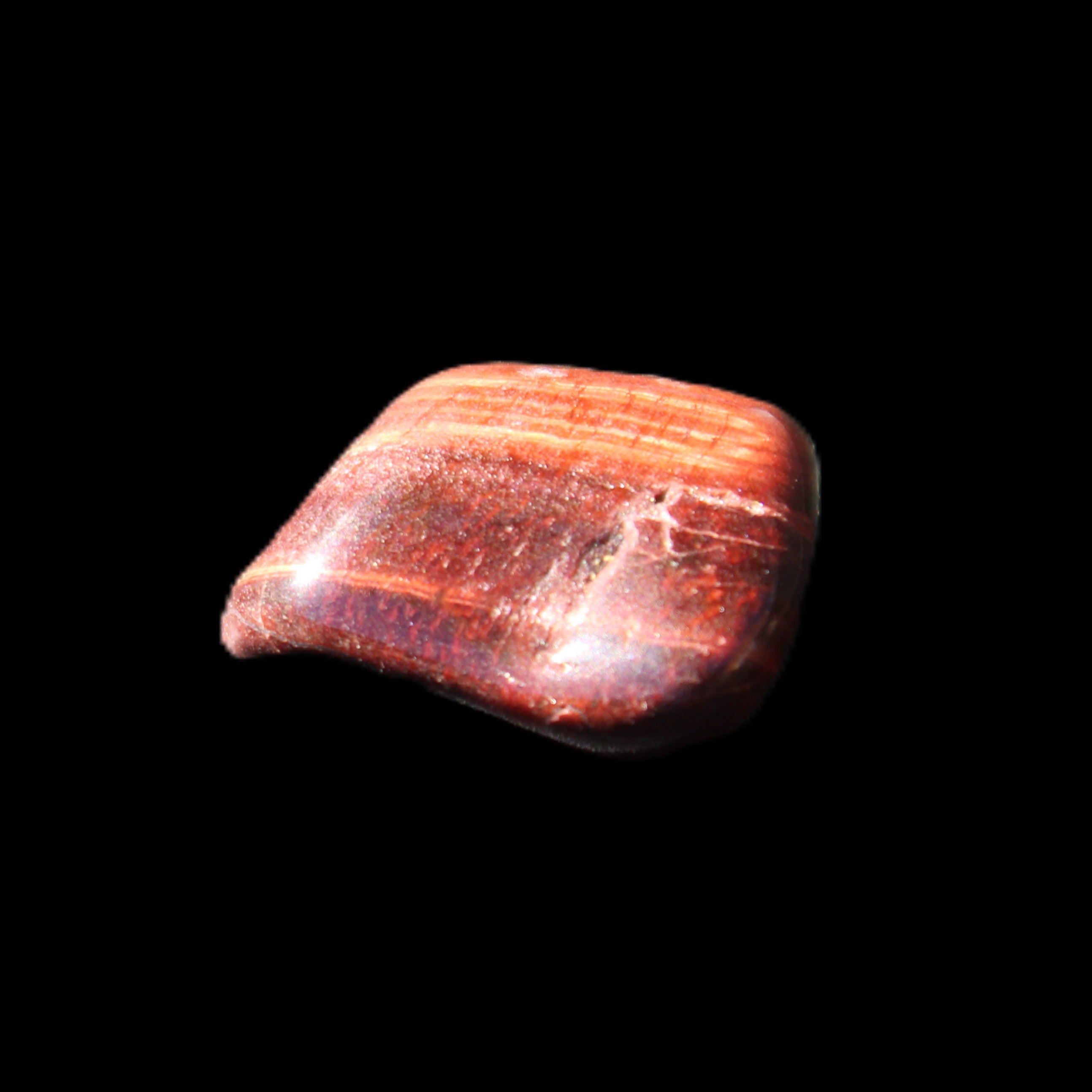 Red Tigers Eye tumbled stone 26/28mm 11/13g in sunlight - Rocks and Things Store