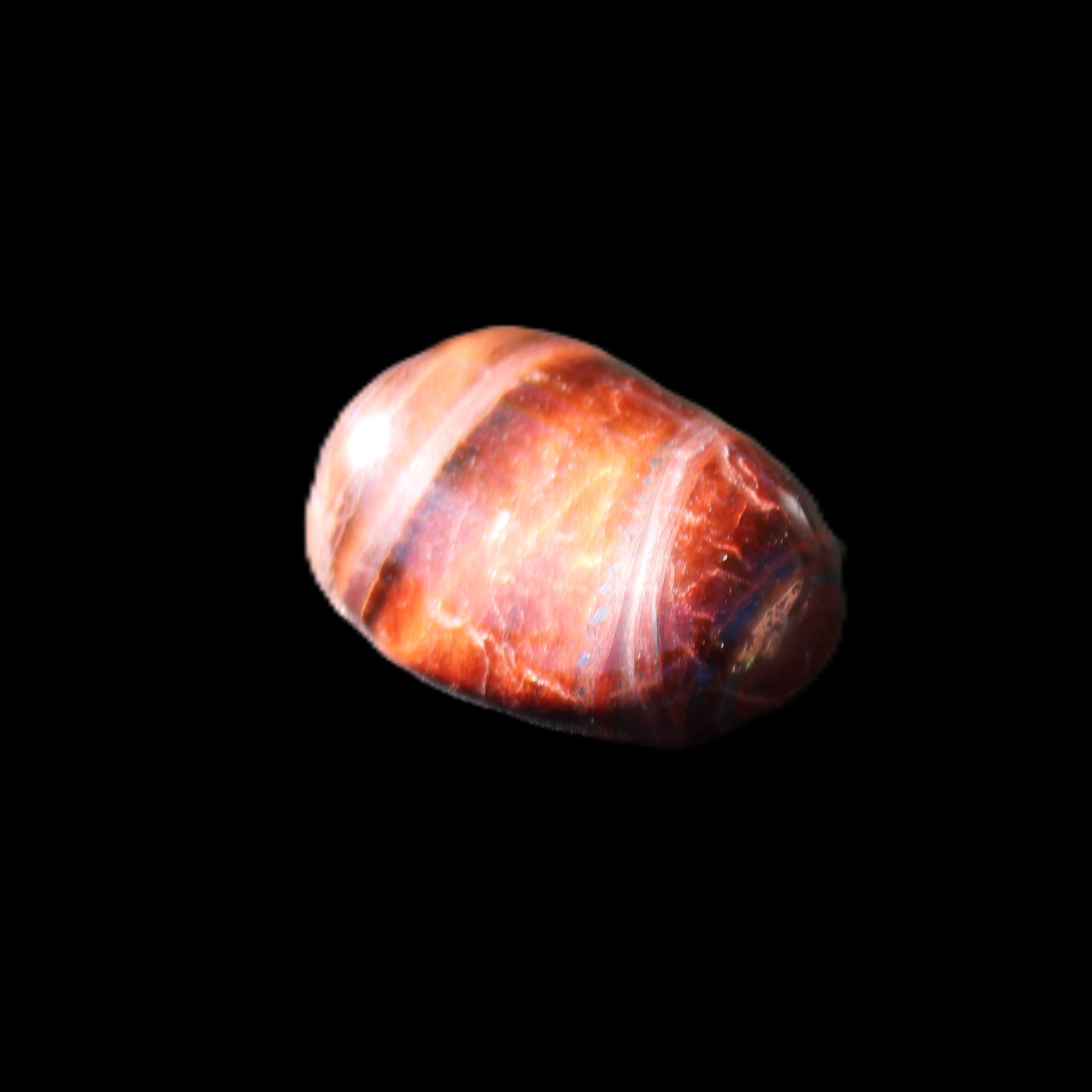 Red Tigers Eye tumbled stone 26/28mm 11/13g in sunlight - Rocks and Things Store