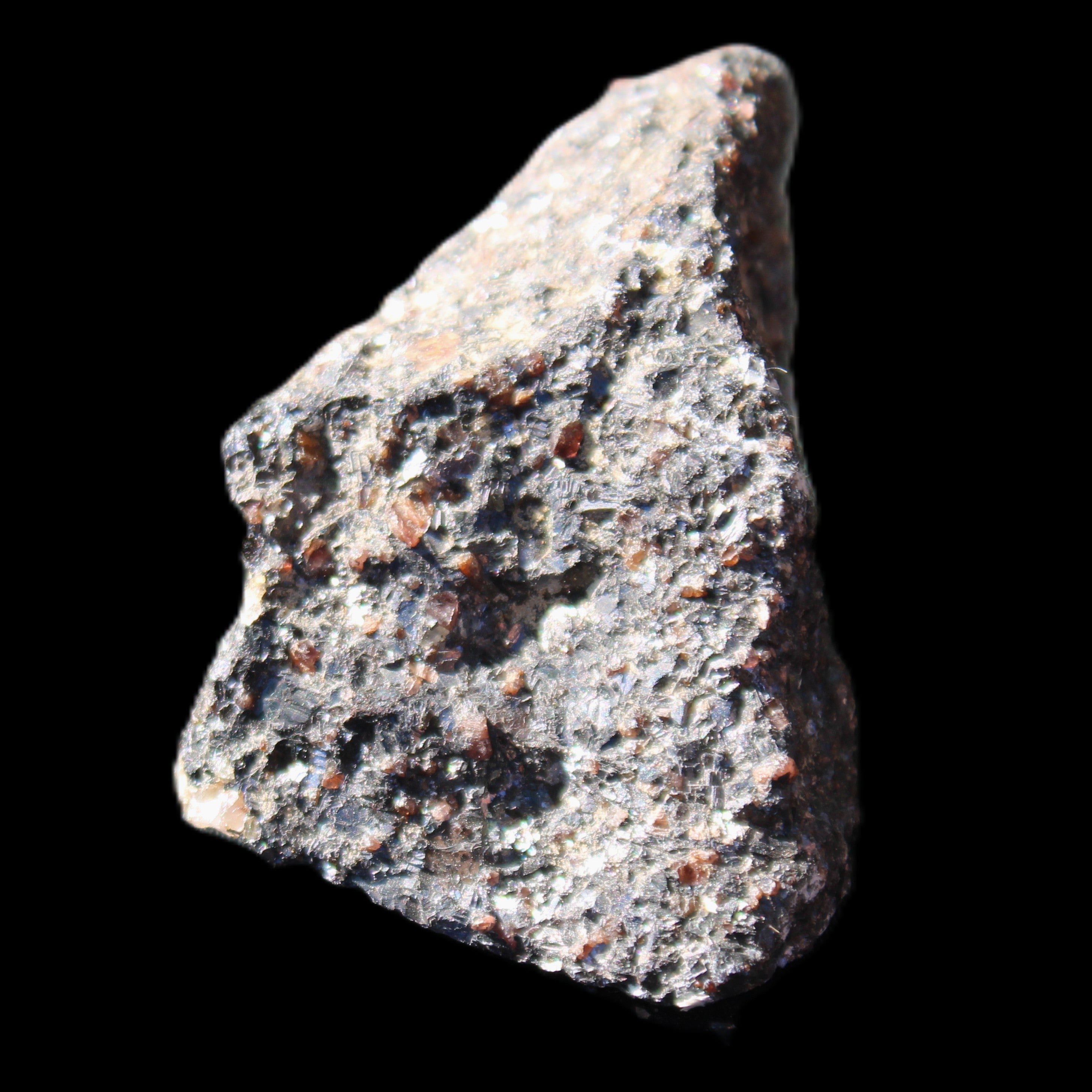 Mineral Ore with Garnet specimen 62*37*30mm 90g in sunlight - Rocks and Things Store