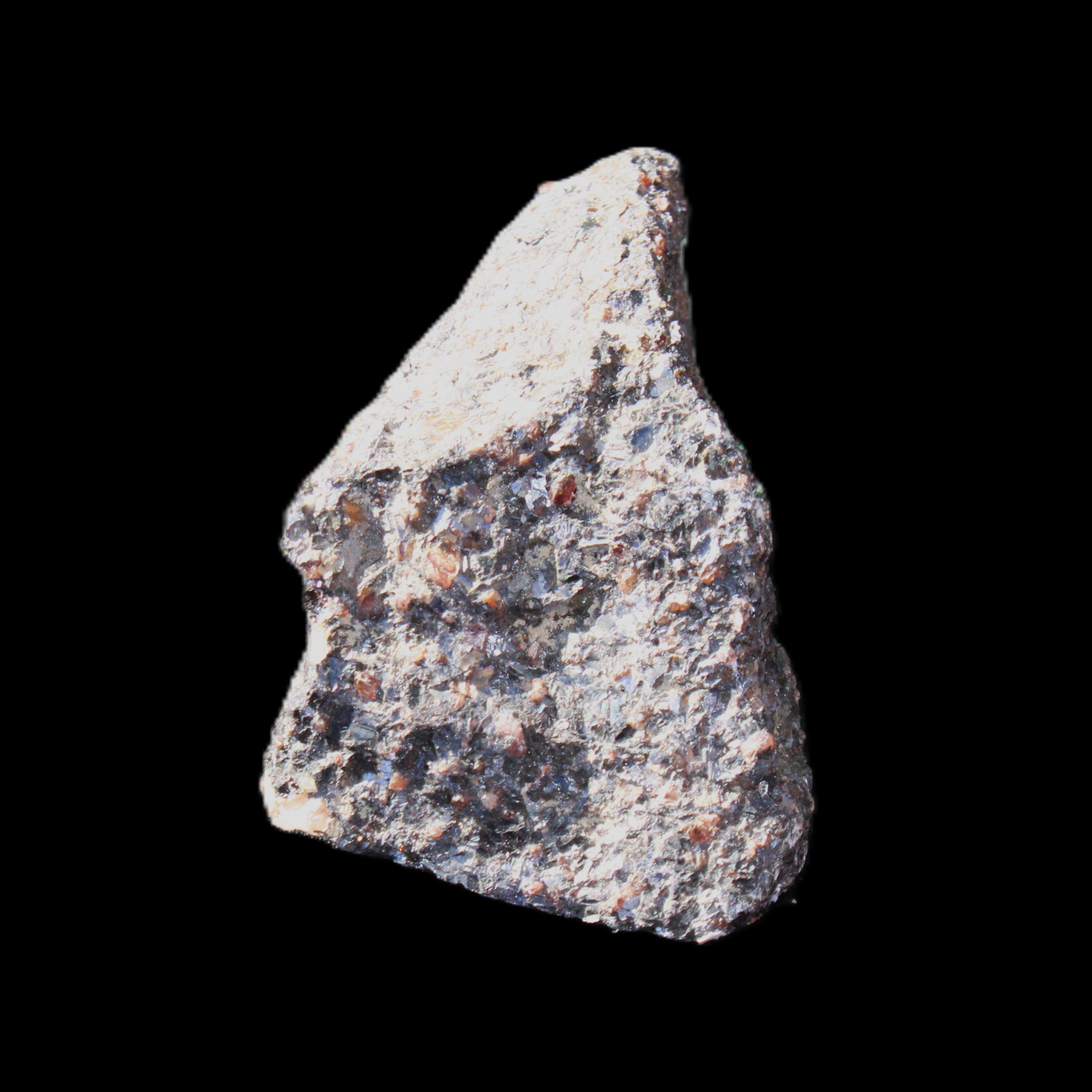 Mineral Ore with Garnet specimen 62*37*30mm 90g in sunlight - Rocks and Things Store