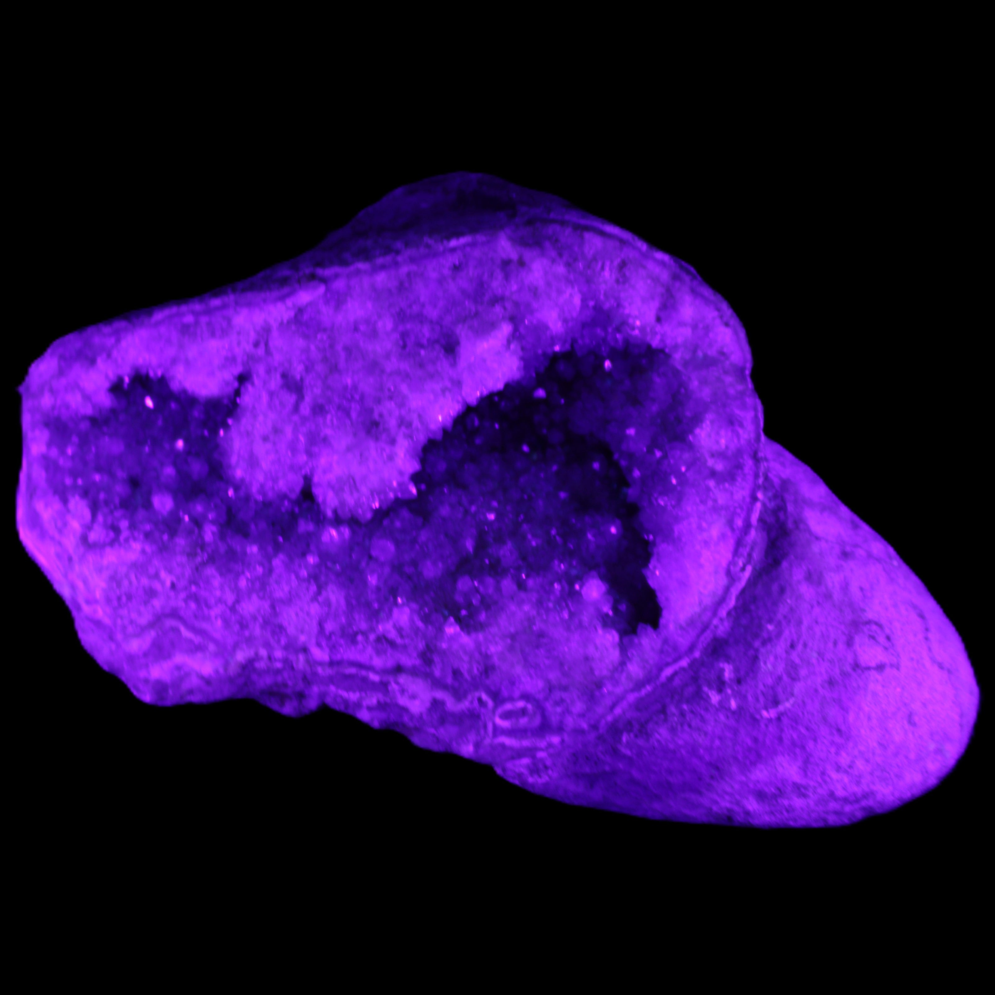 Pink and Violet Amethyst slipper geode 260*190*115mm 3500g in UV light - Rocks and Things Store