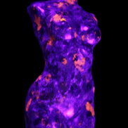 Yooperlite hand carved goddess 40*80mm 156g in UV light - Rocks and Things Store