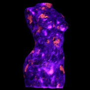 Yooperlite hand carved goddess 40*80mm 156g in UV light - Rocks and Things Store