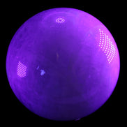 Large Pink Fluorite sphere 150mm 4760g in UV light - Rocks and Things Store