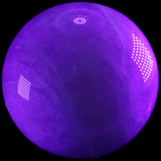 Large Pink Fluorite sphere 150mm 4760g in UV light - Rocks and Things Store