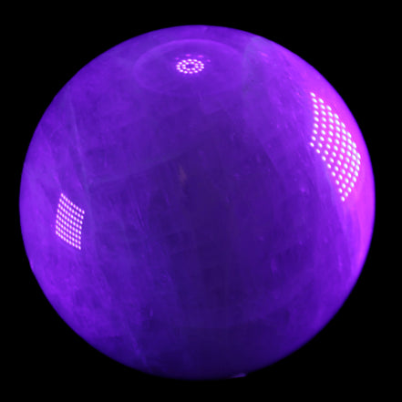 Large Pink Fluorite sphere 150mm 4760g in UV light - Rocks and Things Store