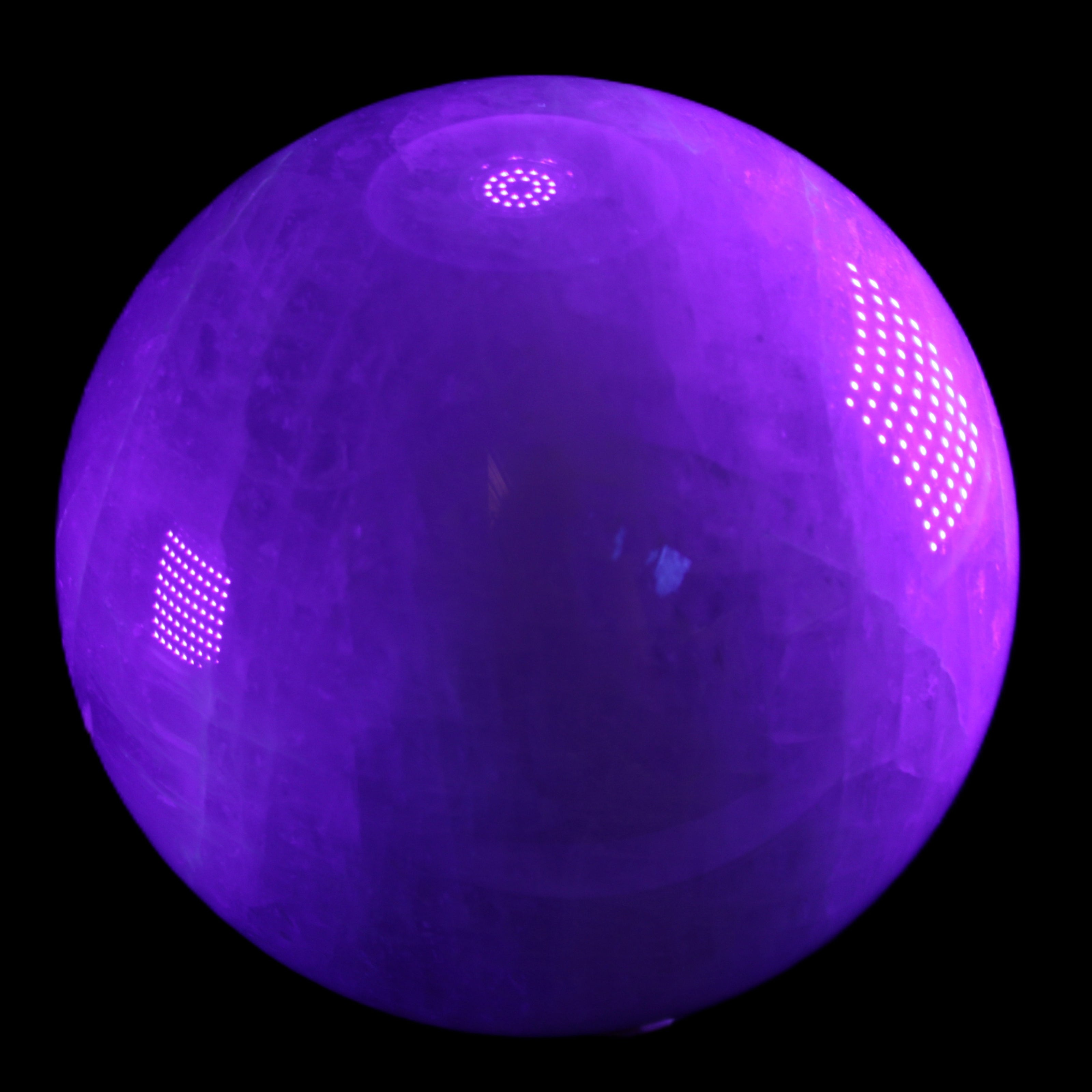 Large Pink Fluorite sphere 150mm 4760g in UV light - Rocks and Things Store