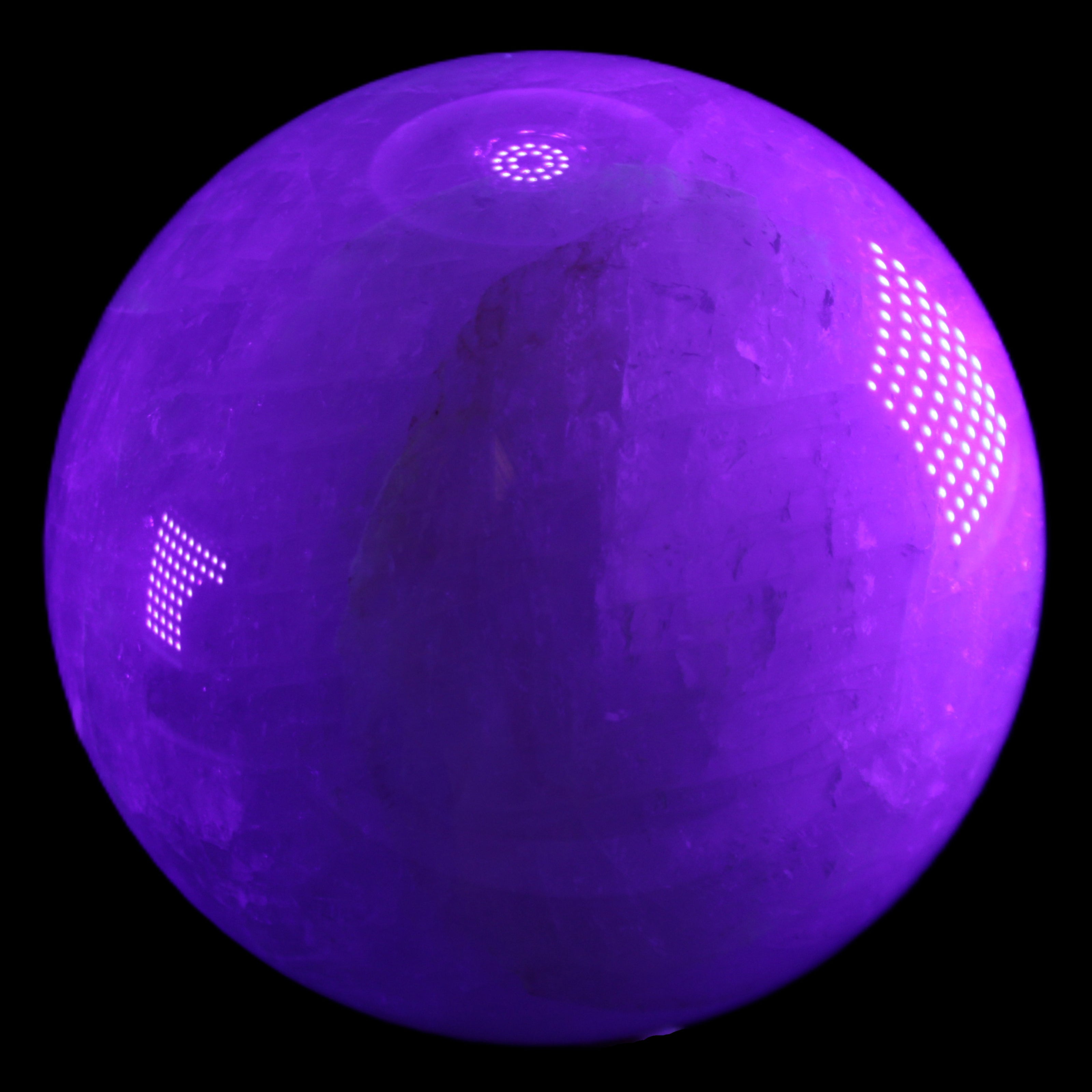 Large Pink Fluorite sphere 150mm 4760g in UV light - Rocks and Things Store