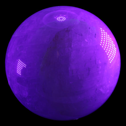 Large Pink Fluorite sphere 150mm 4760g in UV light - Rocks and Things Store
