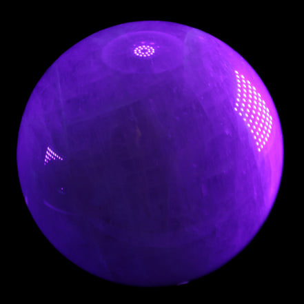 Large Pink Fluorite sphere 150mm 4760g in UV light - Rocks and Things Store