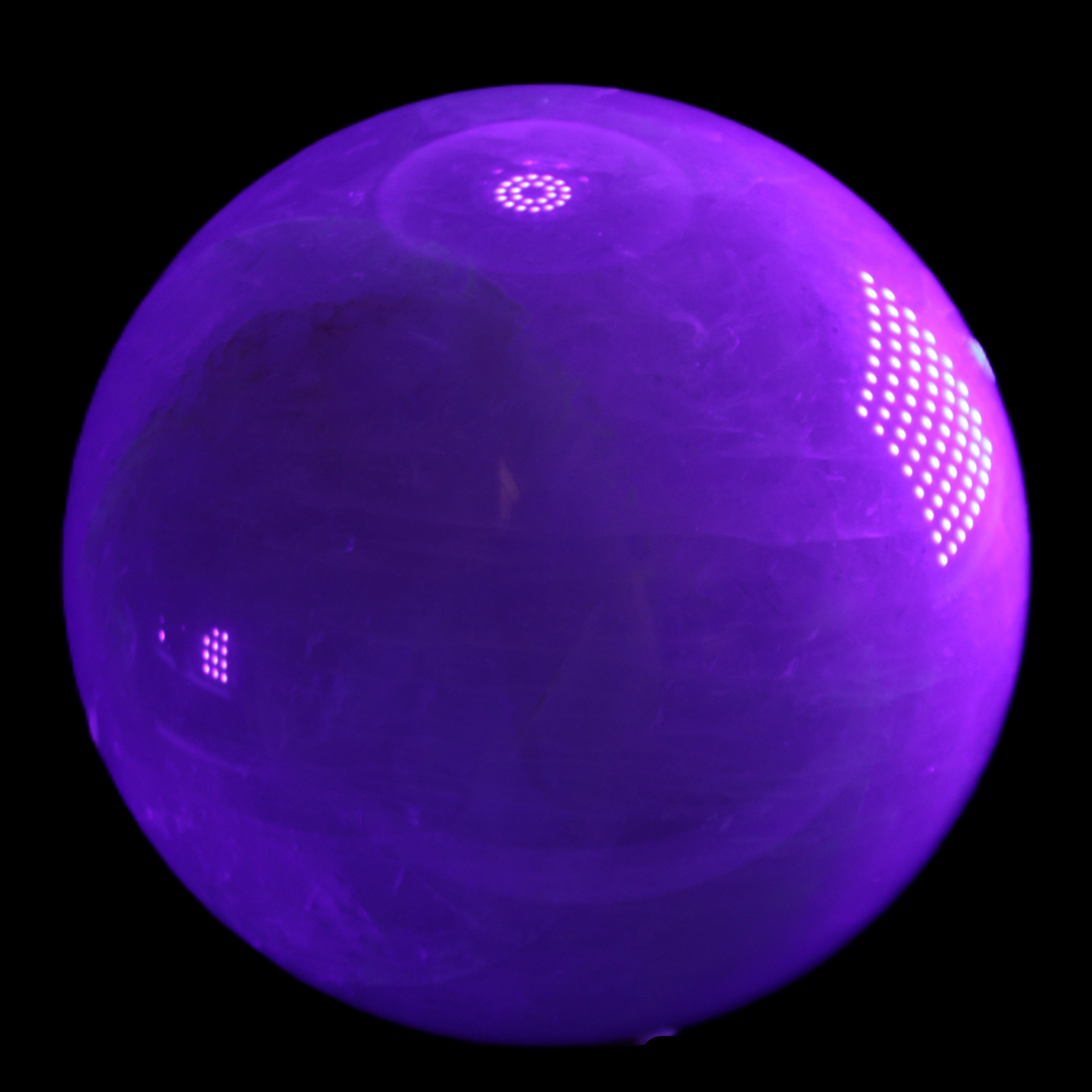 Large Pink Fluorite sphere 150mm 4760g in UV light - Rocks and Things Store