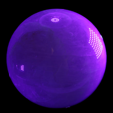 Large Pink Fluorite sphere 150mm 4760g in UV light - Rocks and Things Store