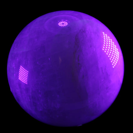 Large Pink Fluorite sphere 150mm 4760g in UV light - Rocks and Things Store