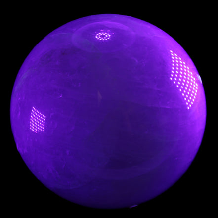 Large Pink Fluorite sphere 150mm 4760g in UV light - Rocks and Things Store