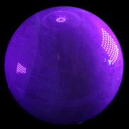 Large Pink Fluorite sphere 150mm 4760g in UV light - Rocks and Things Store