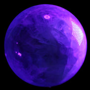 Rainbow Fluorite sphere 130mm 3740g in UV light - Rocks and Things Store