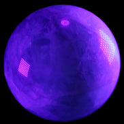Rainbow Fluorite sphere 130mm 3740g in UV light - Rocks and Things Store
