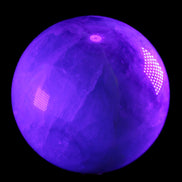 Rainbow Fluorite sphere 130mm 3740g in UV light - Rocks and Things Store