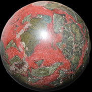 Dragons Blood Stone sphere 146mm 5100g in sunlight - Rocks and Things Store