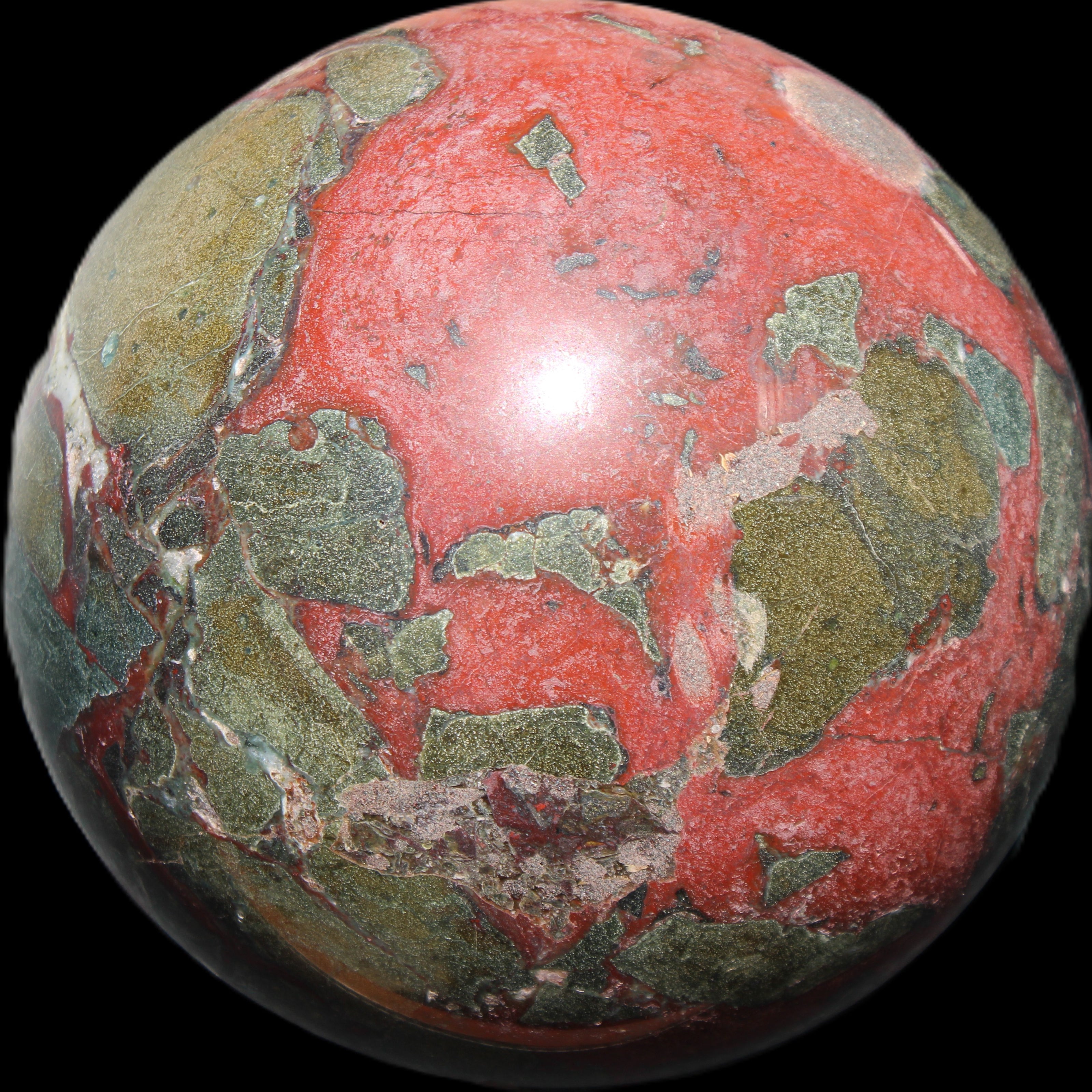 Dragons Blood Stone sphere 146mm 5100g in sunlight - Rocks and Things Store