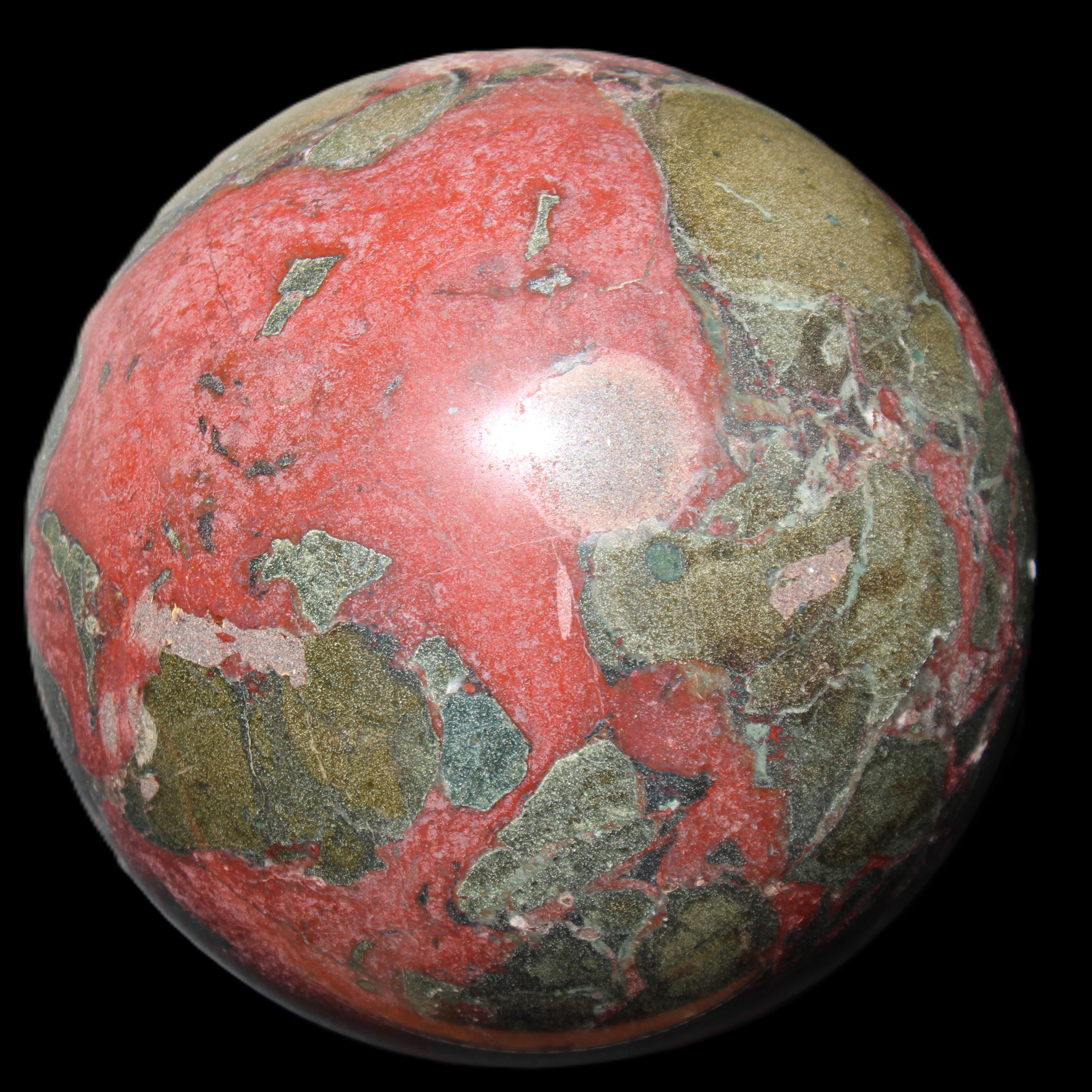 Dragons Blood Stone sphere 146mm 5100g in sunlight - Rocks and Things Store