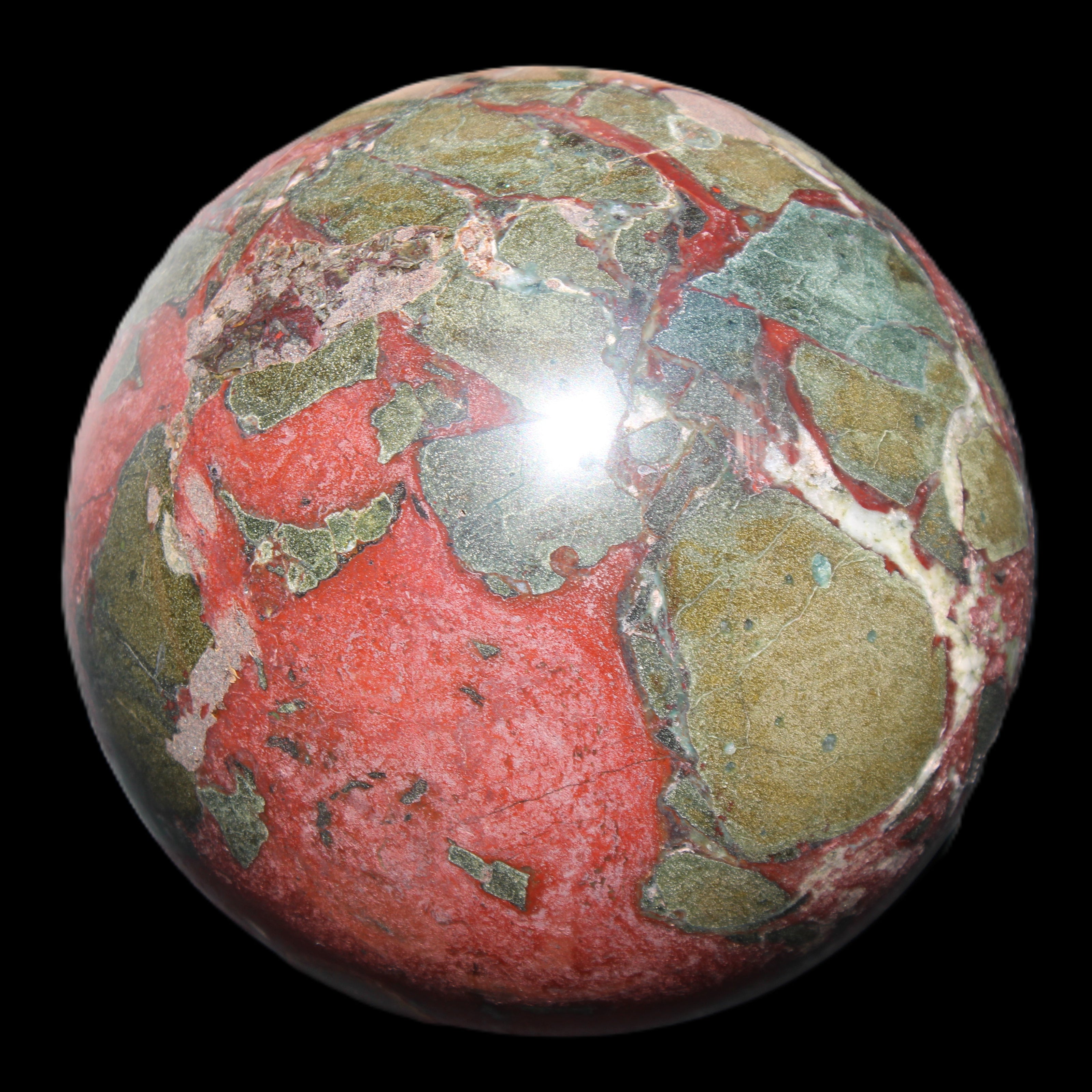 Dragons Blood Stone sphere 146mm 5100g in sunlight - Rocks and Things Store