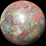 Dragons Blood Stone sphere 146mm 5100g in sunlight - Rocks and Things Store