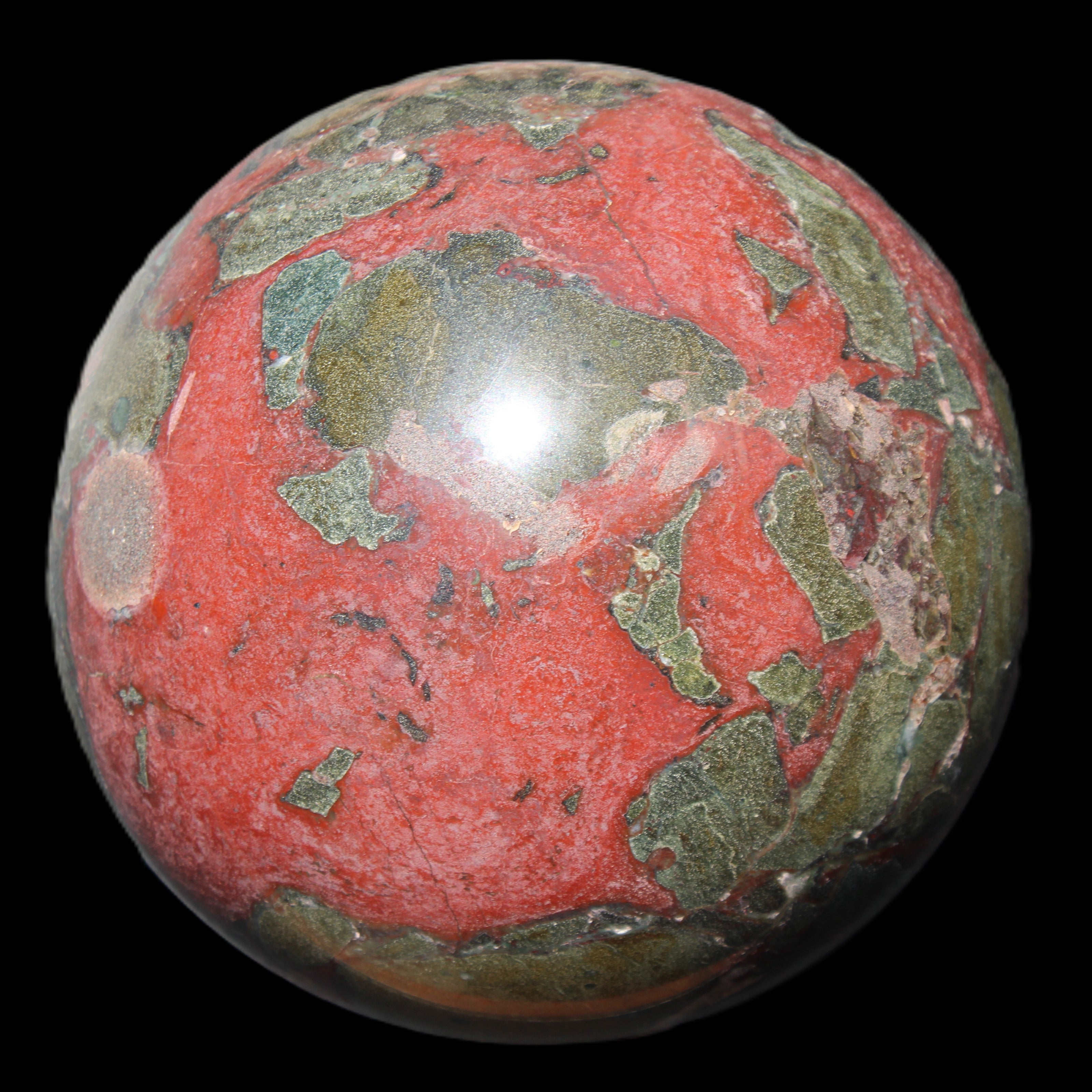 Dragons Blood Stone sphere 146mm 5100g in sunlight - Rocks and Things Store
