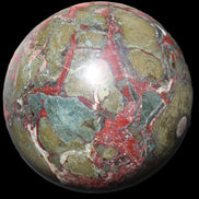 Dragons Blood Stone sphere 146mm 5100g in sunlight - Rocks and Things Store