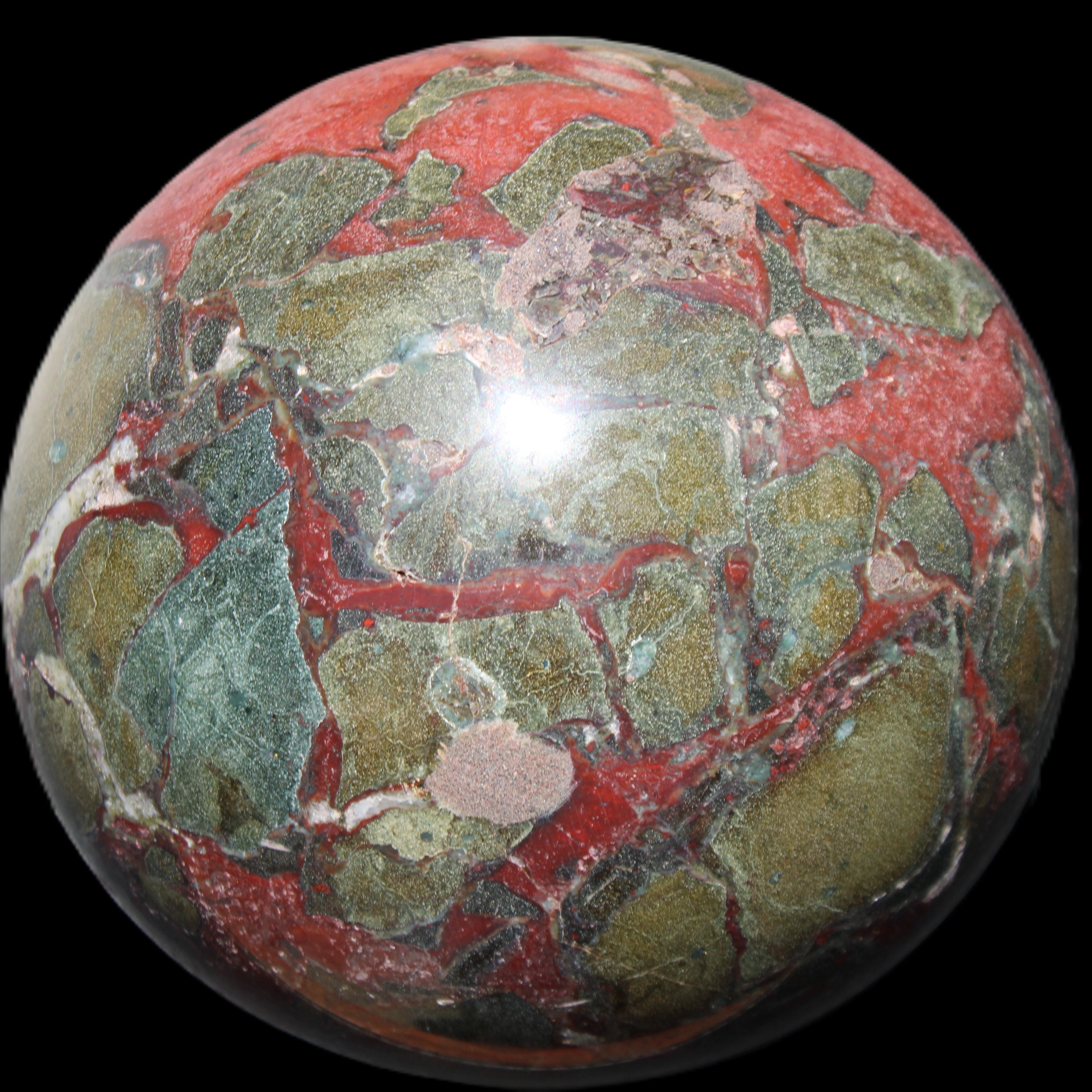 Dragons Blood Stone sphere 146mm 5100g in sunlight - Rocks and Things Store