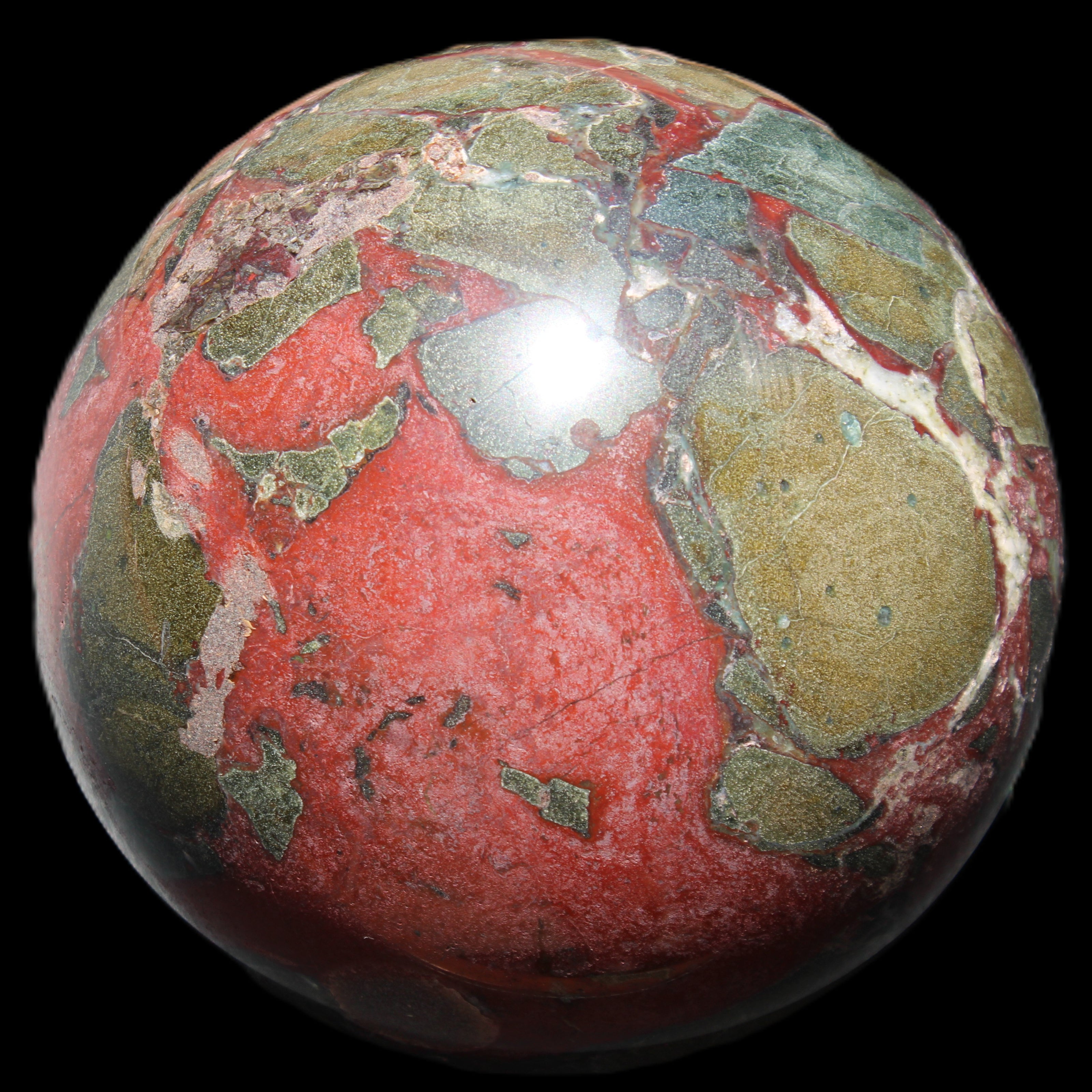 Dragons Blood Stone sphere 146mm 5100g in sunlight - Rocks and Things Store