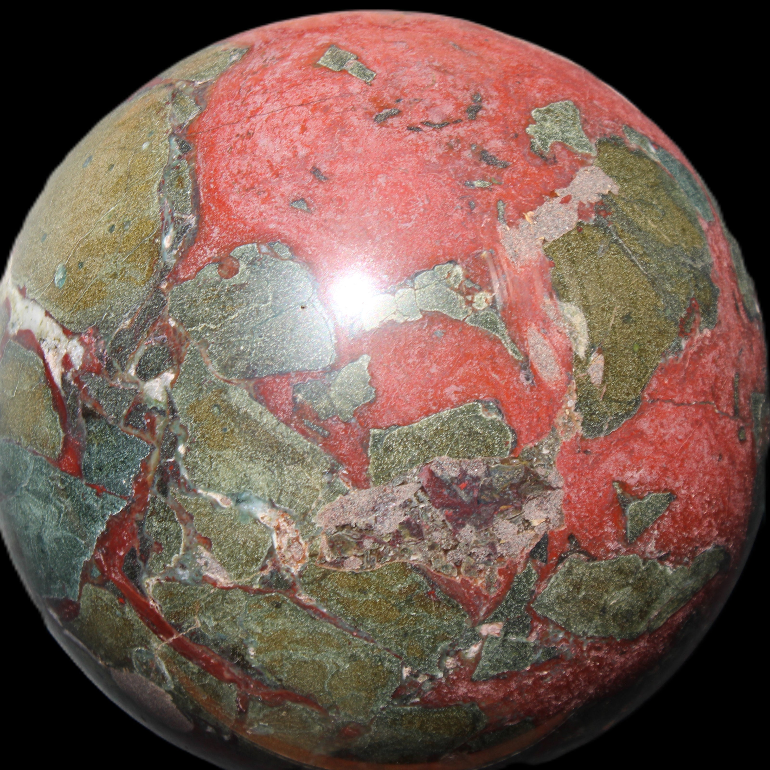 Dragons Blood Stone sphere 146mm 5100g in sunlight - Rocks and Things Store