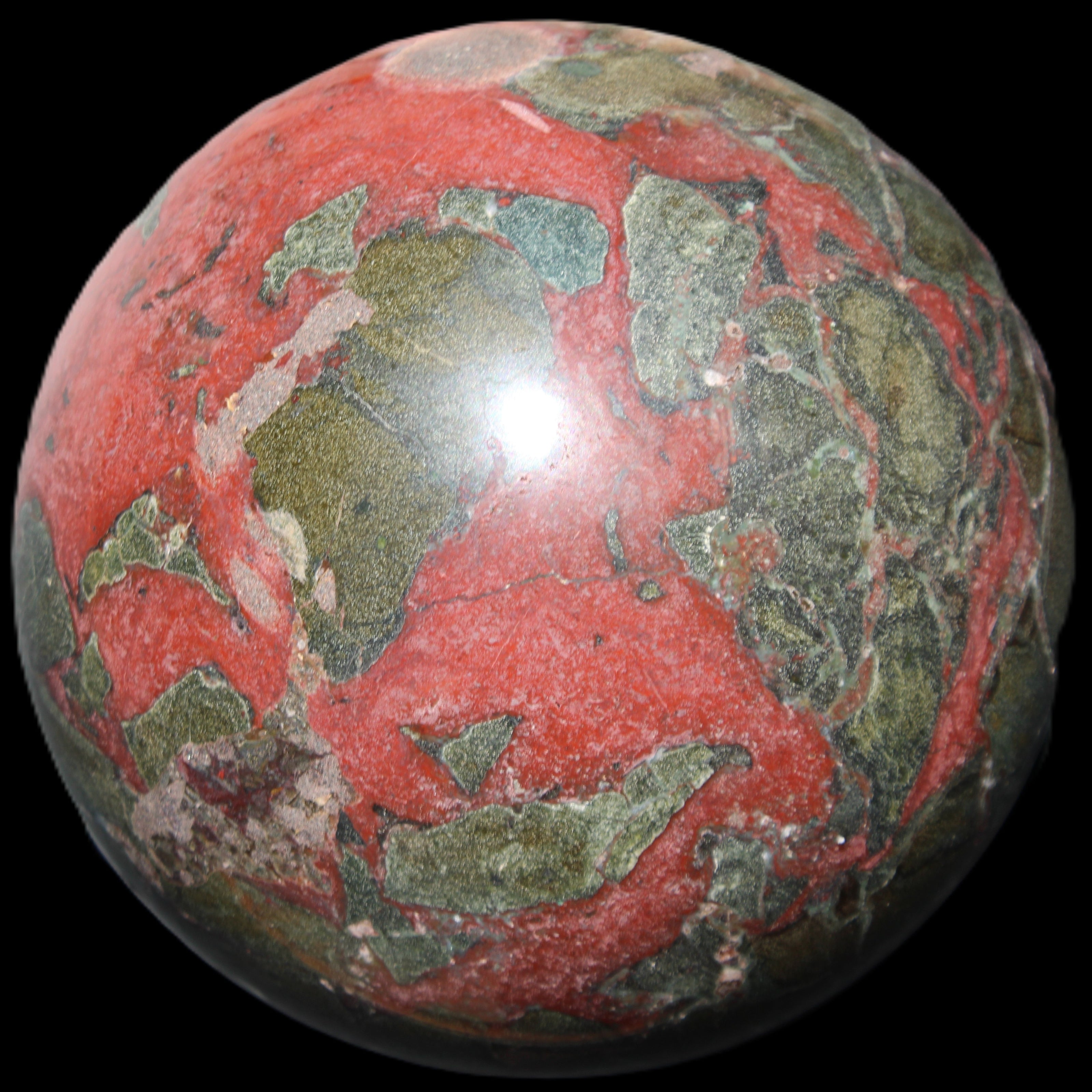 Dragons Blood Stone sphere 146mm 5100g in sunlight - Rocks and Things Store