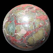 Dragons Blood Stone sphere 146mm 5100g in sunlight - Rocks and Things Store