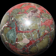 Dragons Blood Stone sphere 146mm 5100g in sunlight - Rocks and Things Store