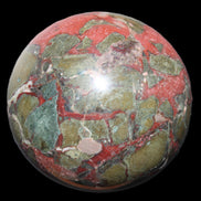 Dragons Blood Stone sphere 146mm 5100g in sunlight - Rocks and Things Store