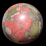 Dragons Blood Stone sphere 146mm 5100g in sunlight - Rocks and Things Store