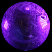 Volcano Agate sphere 135mm 3240g in UV light - Rocks and Things Store