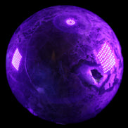 Volcano Agate sphere 135mm 3240g in UV light - Rocks and Things Store