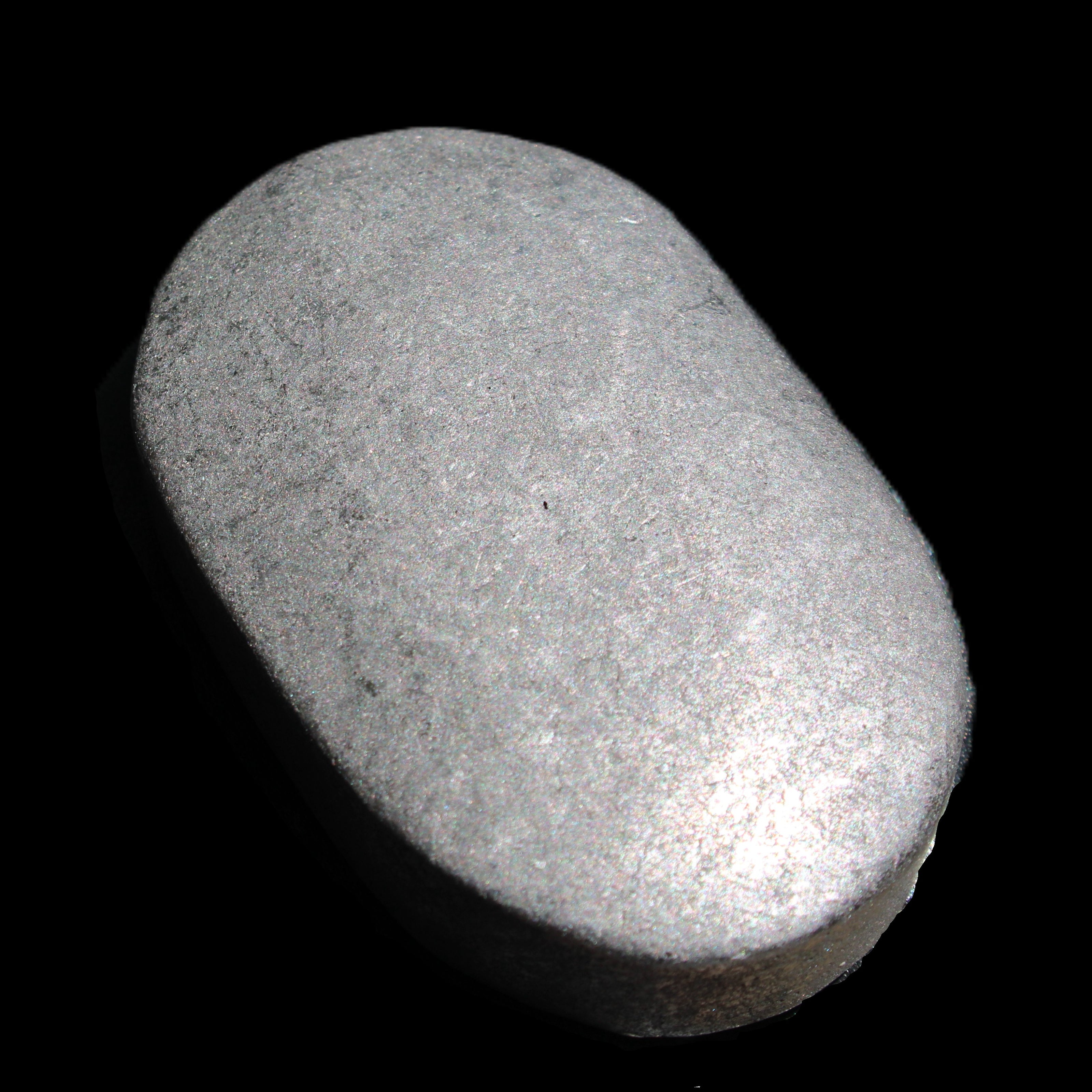 Shungite palmstone 63*40mm 56g in sunlight - Rocks and Things Store