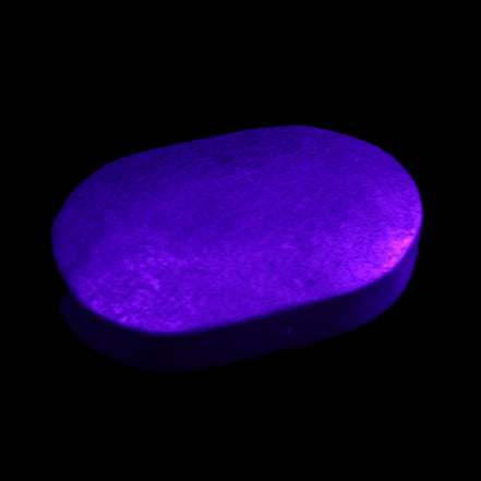Shungite palmstone 63*40mm 56g in UV light - Rocks and Things Store