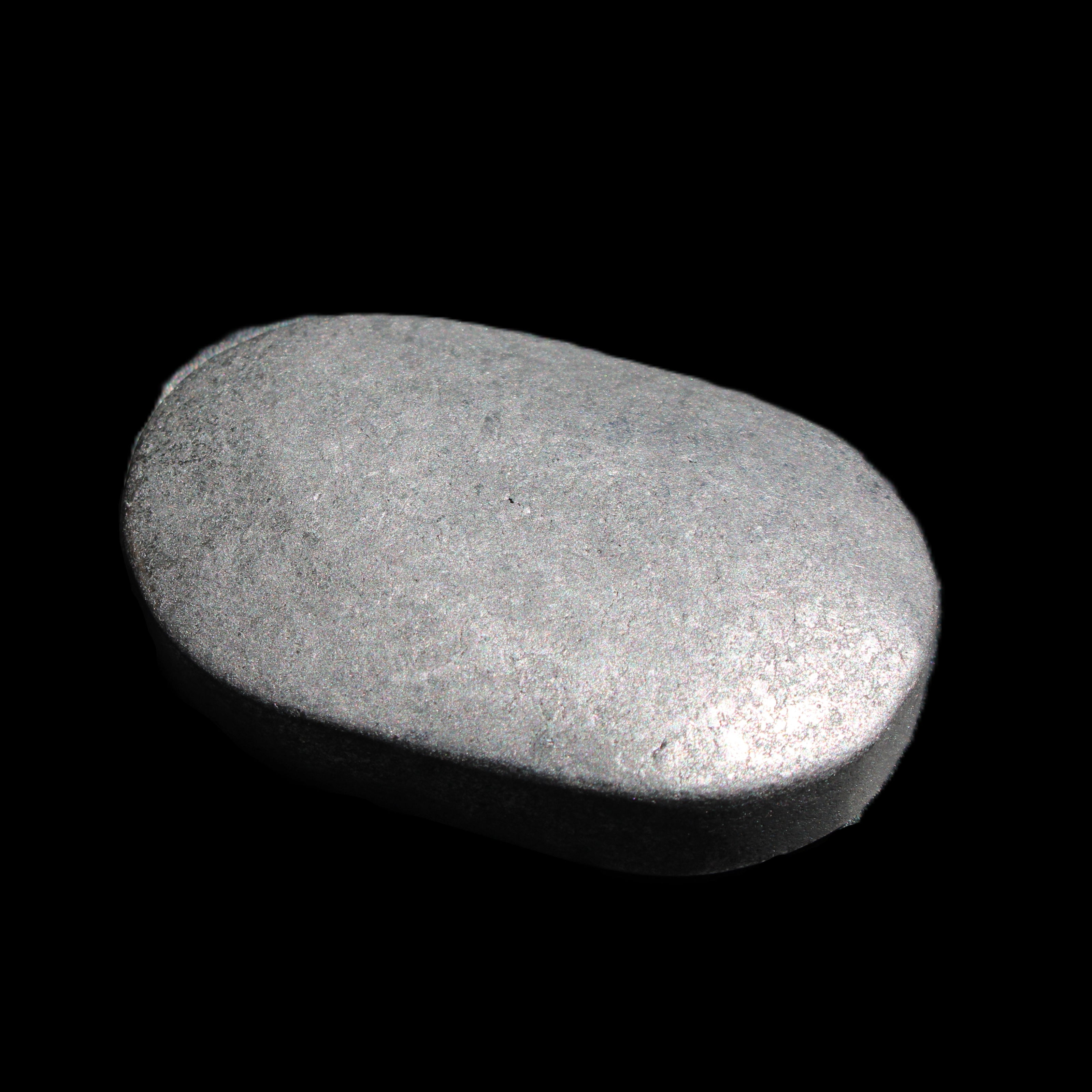 Shungite palmstone 63*40mm 56g in sunlight - Rocks and Things Store