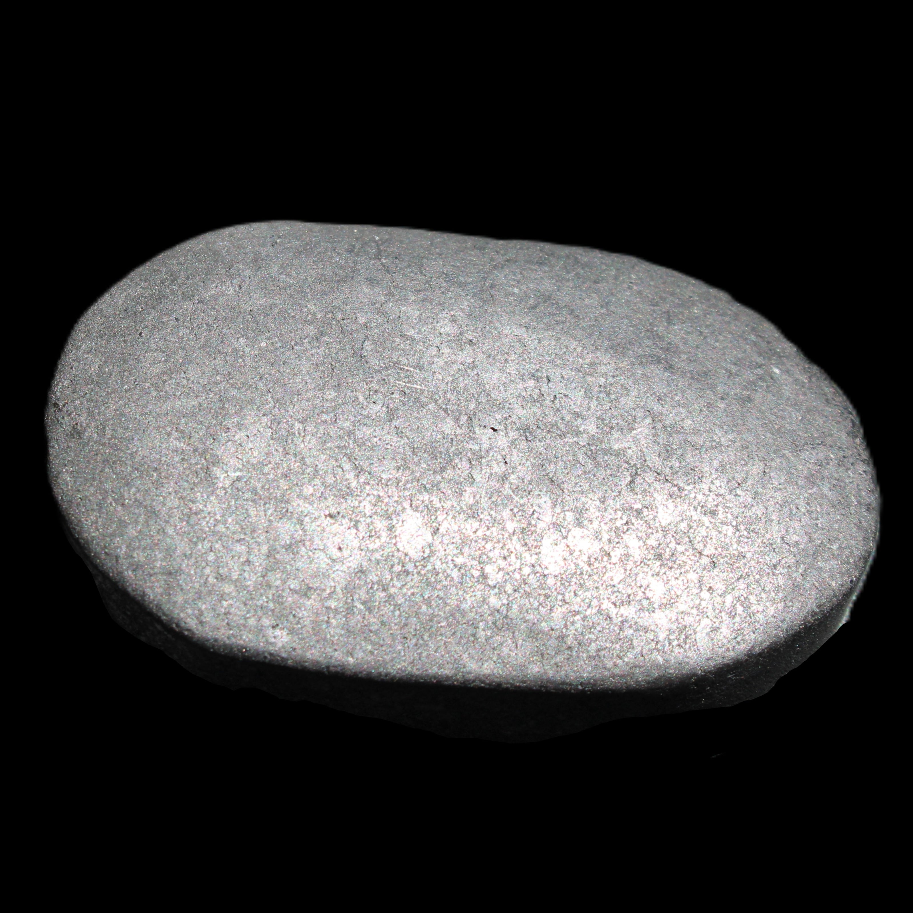 Shungite palmstone 63*40mm 56g in sunlight - Rocks and Things Store