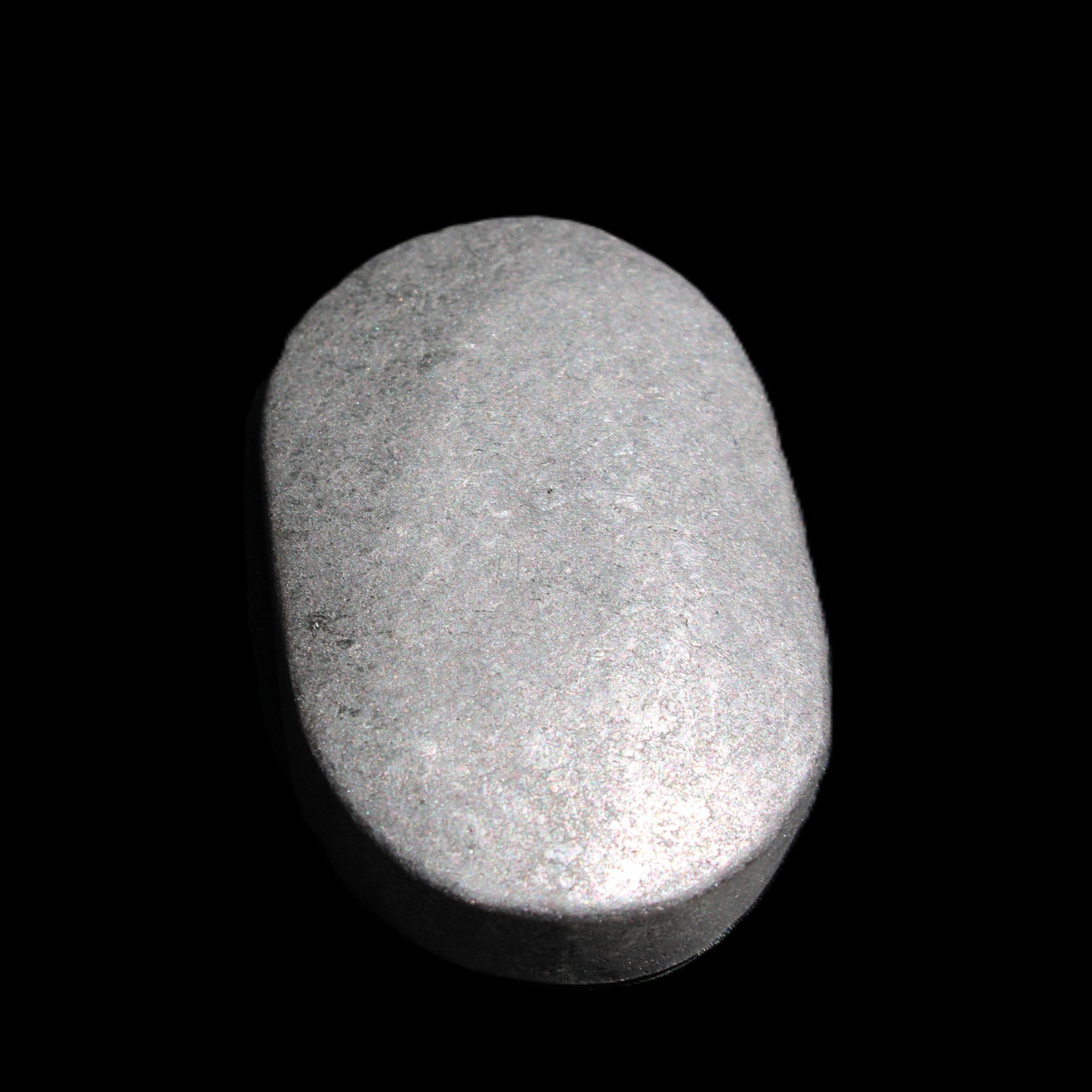 Shungite palmstone 63*40mm 56g in sunlight - Rocks and Things Store